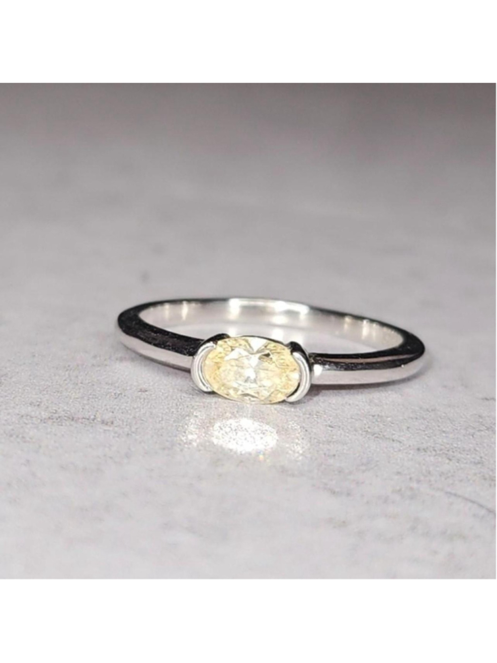 Yellow oval CZ solitaire ring east-west half bezel setting silver tone Size 7
